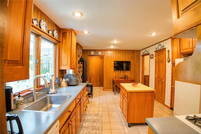 23186 Hatchtown Rd, Spartansburg, PA 16434 - kitchen featuring a sink, butcher block counters, recessed lighting, light tile patterned flooring, and brown cabinets