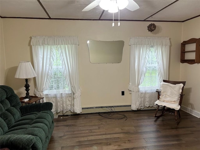 10689 Glenn Blvd, Conneaut Lake, PA 16316 - living area with wood finished floors, ceiling fan, crown molding, and a baseboard radiator