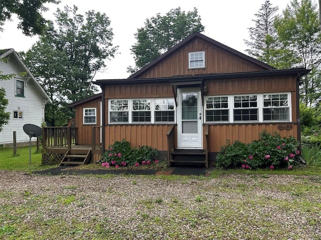 10689 Glenn Blvd, Conneaut Lake, PA 16316 - view of front of house featuring entry steps, board and batten siding, and a deck