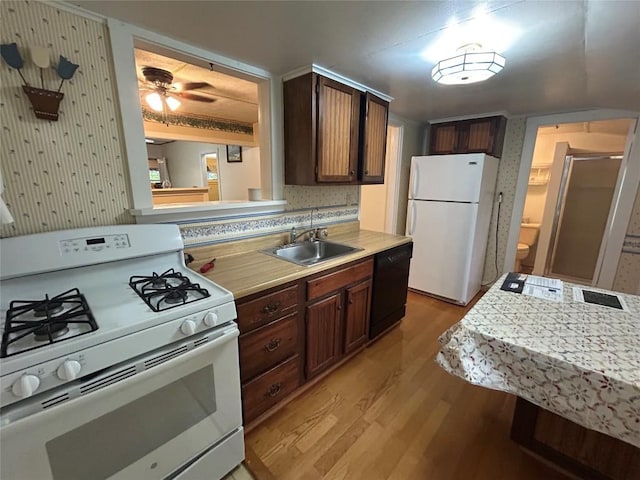 10689 Glenn Blvd, Conneaut Lake, PA 16316 - kitchen with white appliances, light wood-type flooring, light countertops, a ceiling fan, and wallpapered walls