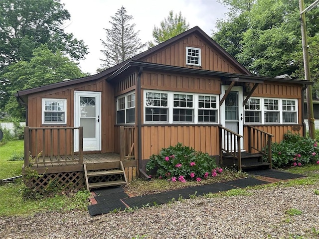 10689 Glenn Blvd, Conneaut Lake, PA 16316 - view of front of home featuring entry steps, a wooden deck, and board and batten siding