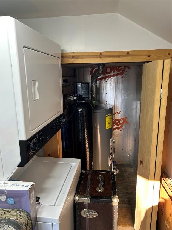10689 Glenn Blvd, Conneaut Lake, PA 16316 - washroom with electric water heater and stacked washer / dryer