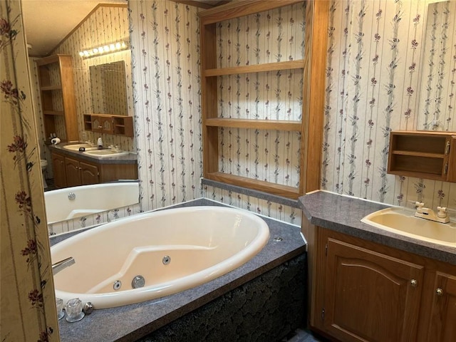 bathroom with a bathing tub and vanity