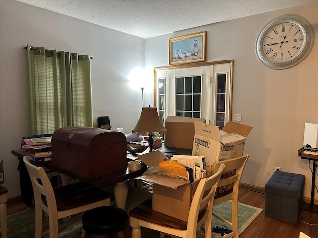 1048 W 6th St, Erie, PA 16507 - dining space with wood finished floors and a textured ceiling