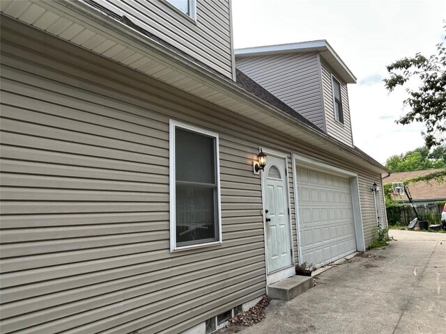 1048 W 6th St, Erie, PA 16507 - view of property exterior with driveway and a garage