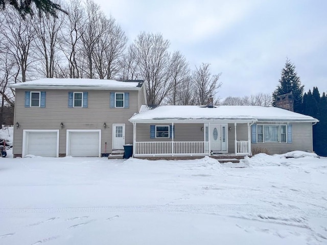 view of front of property with an attached garage, covered porch, and a chimney