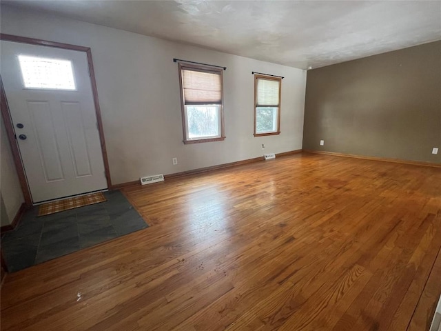 entryway with light hardwood / wood-style floors