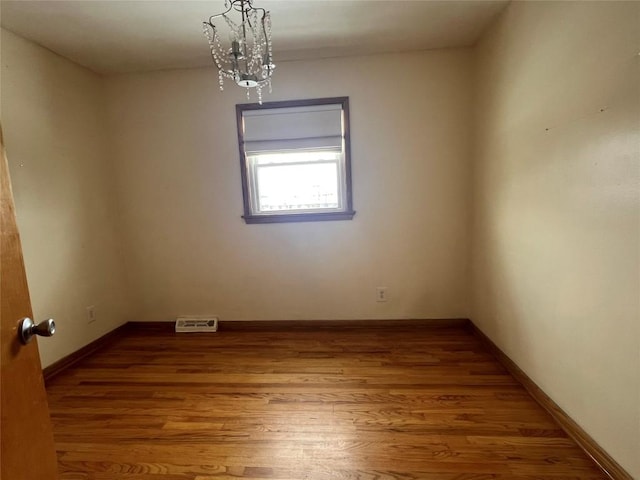 spare room featuring hardwood / wood-style floors