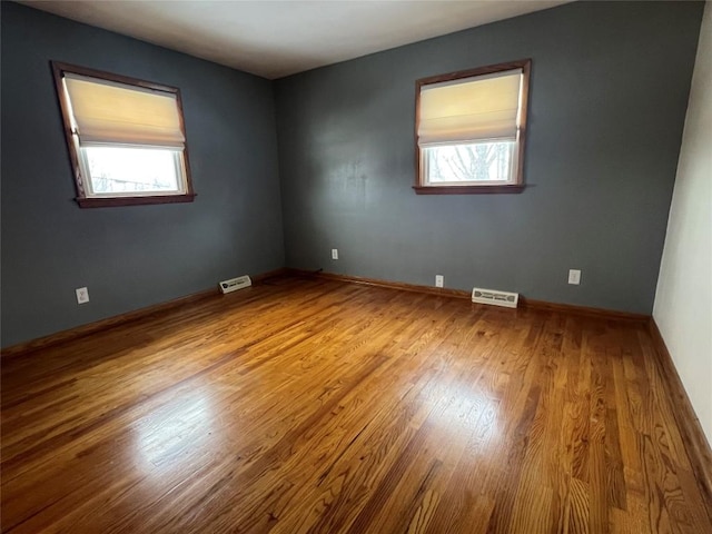 unfurnished room featuring light hardwood / wood-style flooring