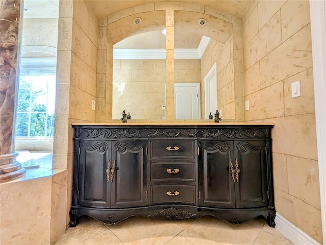 bathroom with vanity, tile walls, and crown molding