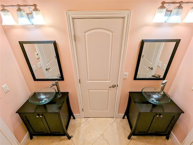 bathroom featuring tile patterned flooring and vanity