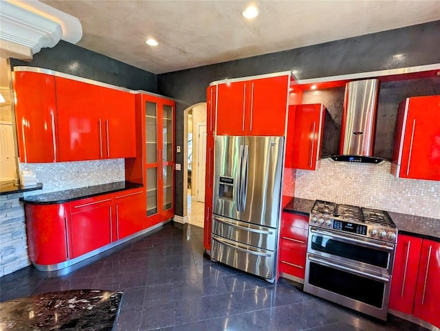 kitchen featuring backsplash, stainless steel appliances, and wall chimney exhaust hood