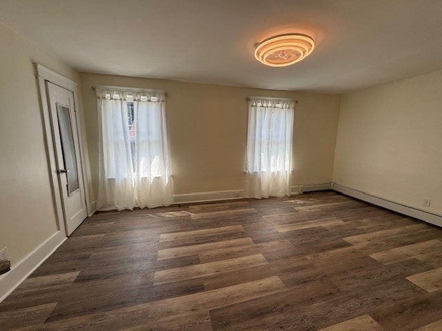 334 E 28th St, Erie, PA 16504 - spare room featuring plenty of natural light and dark wood-style floors