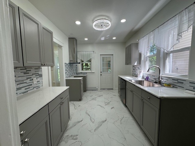 334 E 28th St, Erie, PA 16504 - kitchen with gray cabinetry, recessed lighting, wall chimney range hood, and backsplash