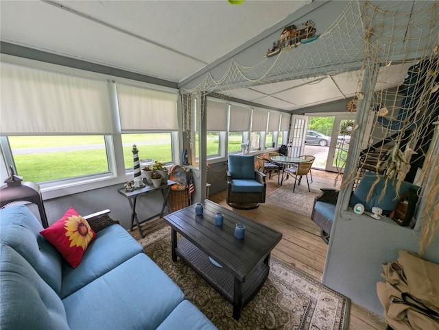 8734 Colonial Ln, Linesville, PA 16424 - sunroom featuring wood finished floors, lofted ceiling, outdoor lounge area, and outdoor dining space