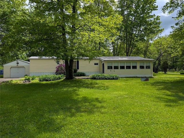 8734 Colonial Ln, Linesville, PA 16424 - view of front of home featuring an outbuilding, a front lawn, and a detached garage