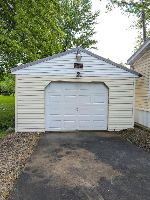 8734 Colonial Ln, Linesville, PA 16424 - garage featuring driveway