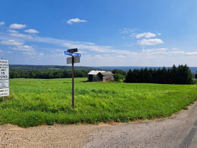 exterior space with a rural view