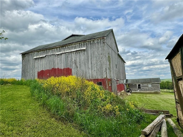 view of home's exterior featuring an outdoor structure