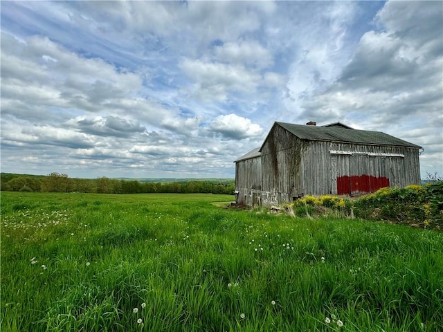 view of outbuilding featuring a rural view