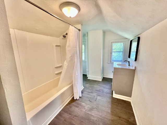 3624 Buffalo Rd, Erie, PA 16510 - bathroom featuring wood finished floors, vaulted ceiling, baseboards, shower / tub combo with curtain, and vanity