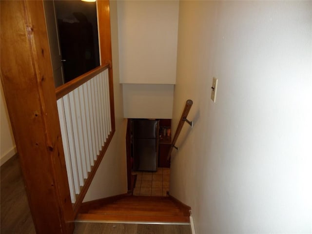 staircase featuring hardwood / wood-style flooring