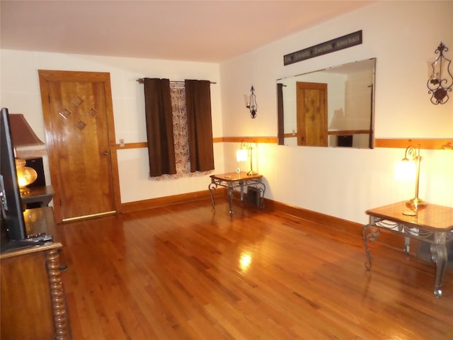 unfurnished room featuring hardwood / wood-style flooring