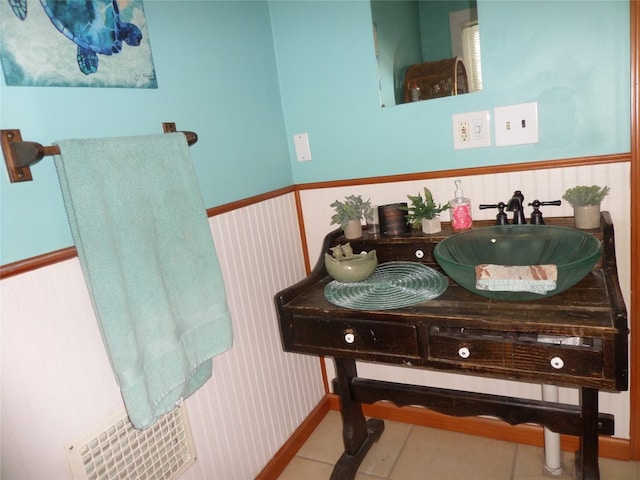 bathroom with tile patterned flooring and sink