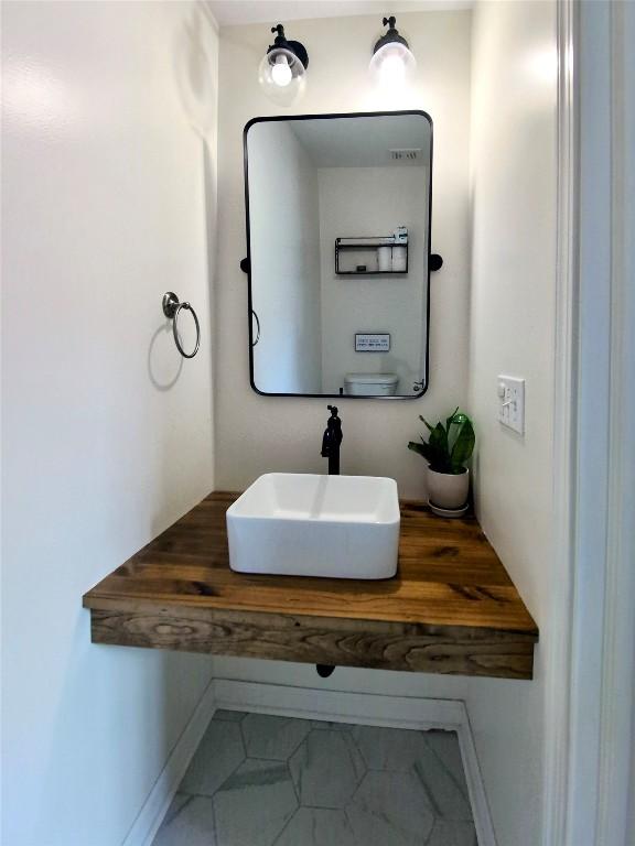732 Walbridge Rd, Erie, PA 16511 - bathroom with a sink and tile patterned flooring