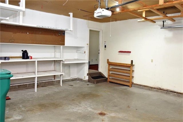 garage featuring a workshop area and a garage door opener