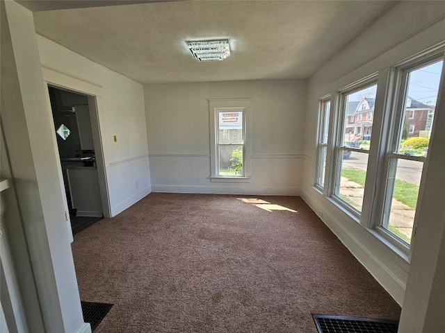 963 W 7th St, Erie, PA 16502 - empty room with carpet floors and a textured ceiling