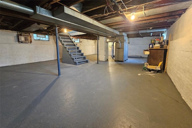 963 W 7th St, Erie, PA 16502 - below grade area featuring stairway, electric panel, and heating unit