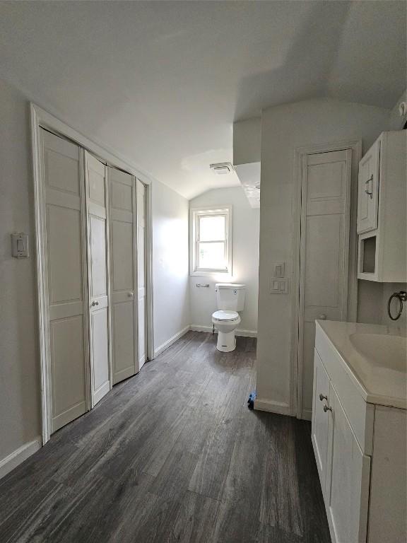 963 W 7th St, Erie, PA 16502 - bathroom featuring vaulted ceiling, wood finished floors, and vanity