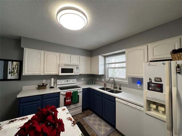 kitchen with white cabinetry, sink, blue cabinets, a textured ceiling, and white appliances