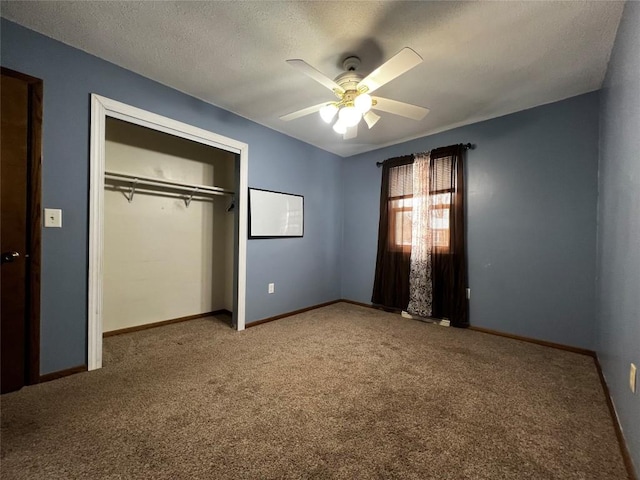 unfurnished bedroom featuring carpet flooring, ceiling fan, a textured ceiling, and a closet