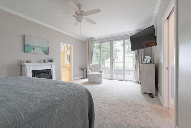 8280 Shore Dr, Fairview, PA 16415 - carpeted bedroom with access to exterior, crown molding, a glass covered fireplace, a ceiling fan, and ensuite bathroom