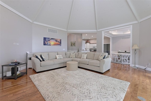 8280 Shore Dr, Fairview, PA 16415 - living room with high vaulted ceiling and wood finished floors