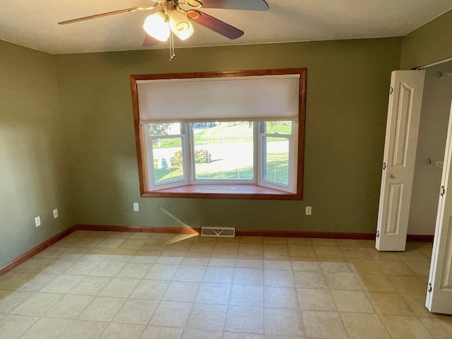 spare room featuring ceiling fan