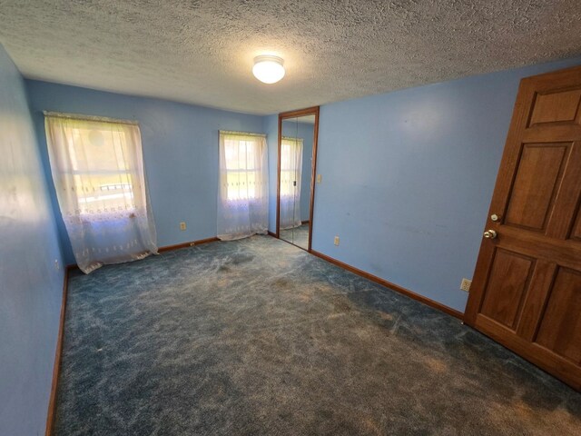 10827 Springs Rd, Meadville, PA 16335 - unfurnished room with baseboards, carpet, and a textured ceiling