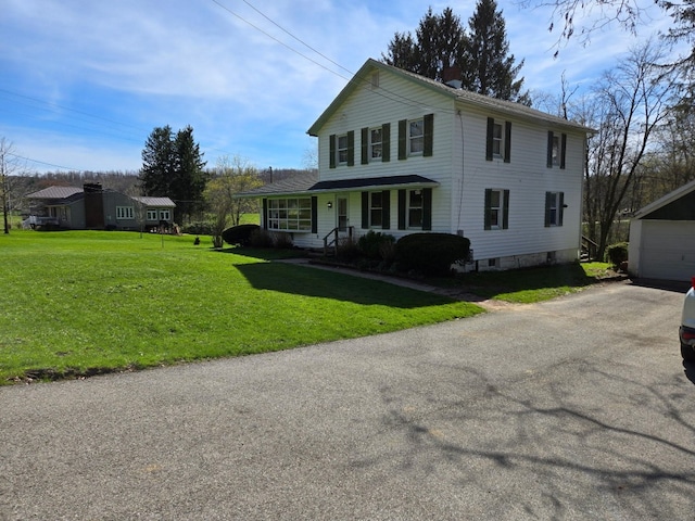 10827 Springs Rd, Meadville, PA 16335 - view of front of property featuring a chimney, an outdoor structure, a porch, a front yard, and a garage