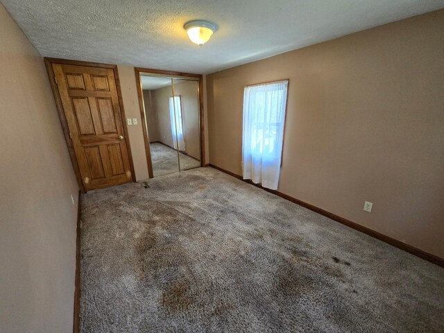 10827 Springs Rd, Meadville, PA 16335 - unfurnished room featuring baseboards, carpet flooring, and a textured ceiling