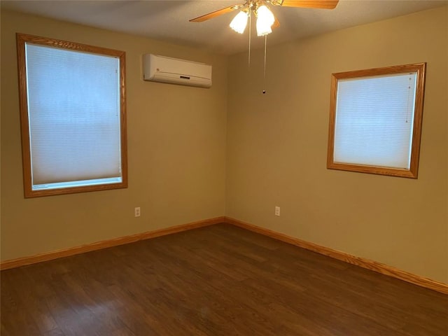 empty room featuring a wall mounted air conditioner, ceiling fan, and dark wood-type flooring