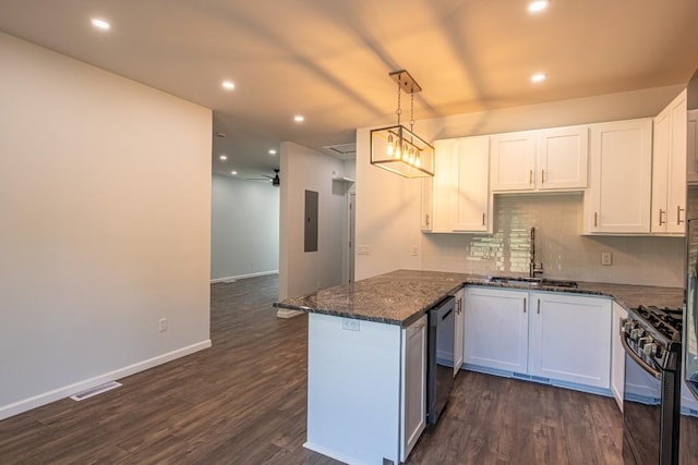 kitchen with kitchen peninsula, black range with gas stovetop, white cabinetry, and sink