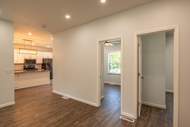 interior space with dark hardwood / wood-style flooring