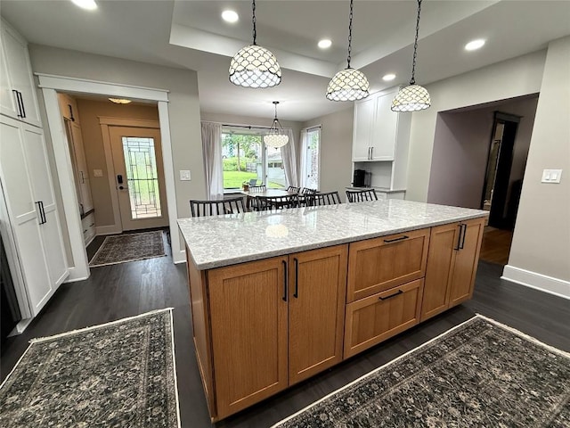 566 Walnut St, Meadville, PA 16335 - kitchen featuring dark wood finished floors, recessed lighting, a kitchen island, light stone countertops, and pendant lighting