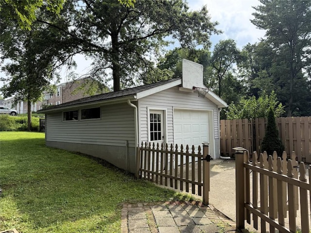 566 Walnut St, Meadville, PA 16335 - view of side of property with an outdoor structure, a chimney, and a detached garage