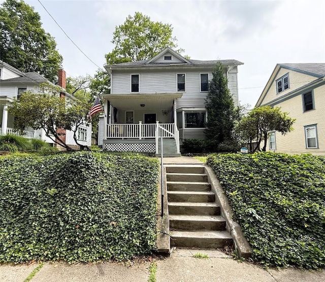 566 Walnut St, Meadville, PA 16335 - american foursquare style home featuring stairs and a porch