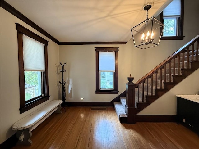566 Walnut St, Meadville, PA 16335 - entryway featuring a chandelier, stairway, healthy amount of natural light, and ornamental molding