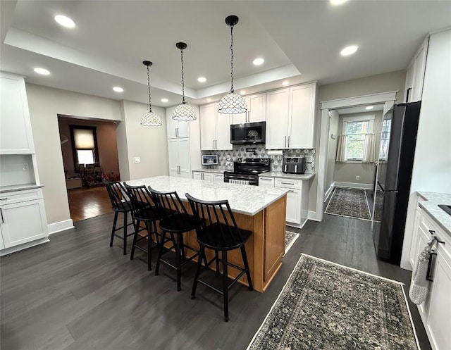 566 Walnut St, Meadville, PA 16335 - kitchen featuring stainless steel microwave, electric range, freestanding refrigerator, dark wood-style floors, and recessed lighting