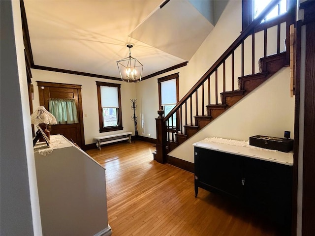 566 Walnut St, Meadville, PA 16335 - entryway featuring a chandelier, hardwood / wood-style floors, stairway, and crown molding
